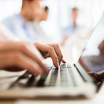 typing-at-laptop