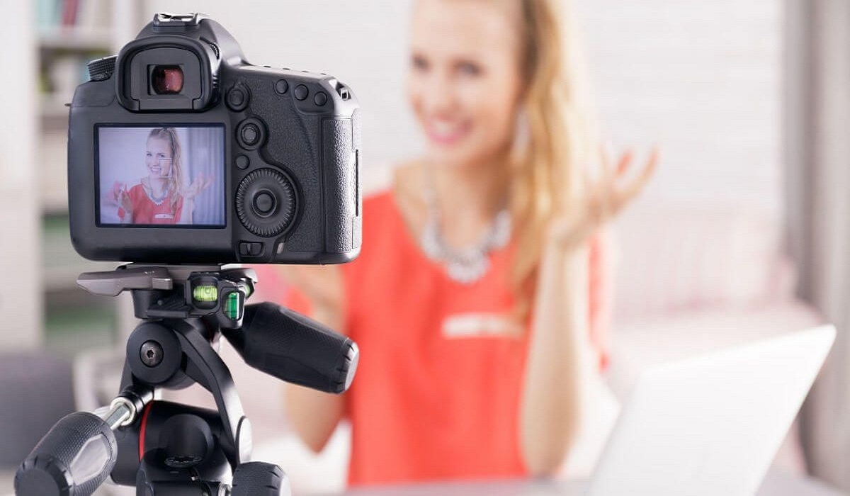 a researcher uses a video camera to record